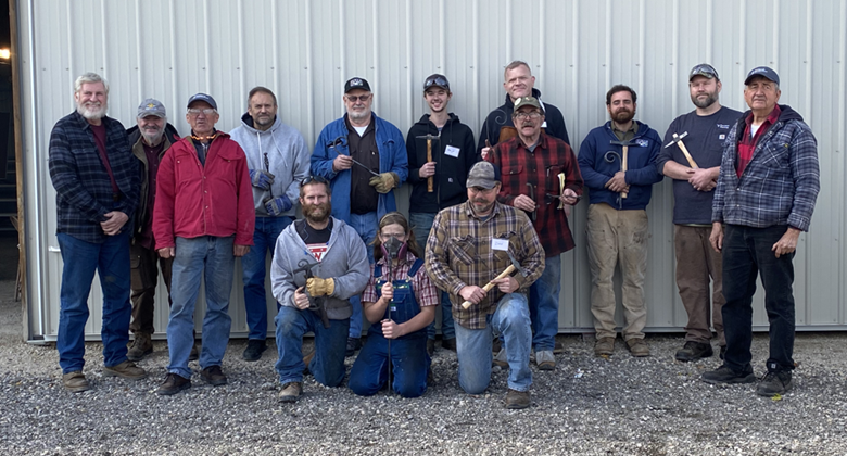 Instructors Johns McLellan and Frank Annighofer with a group of students working on the National Curriculum at the Upper Midwest Regional Blacksmith Association Conference in 2022.