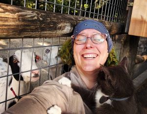 ABANA member, Chelsea Brimer, receives attention from the animals at Deanna Rose Children's Farmstead.